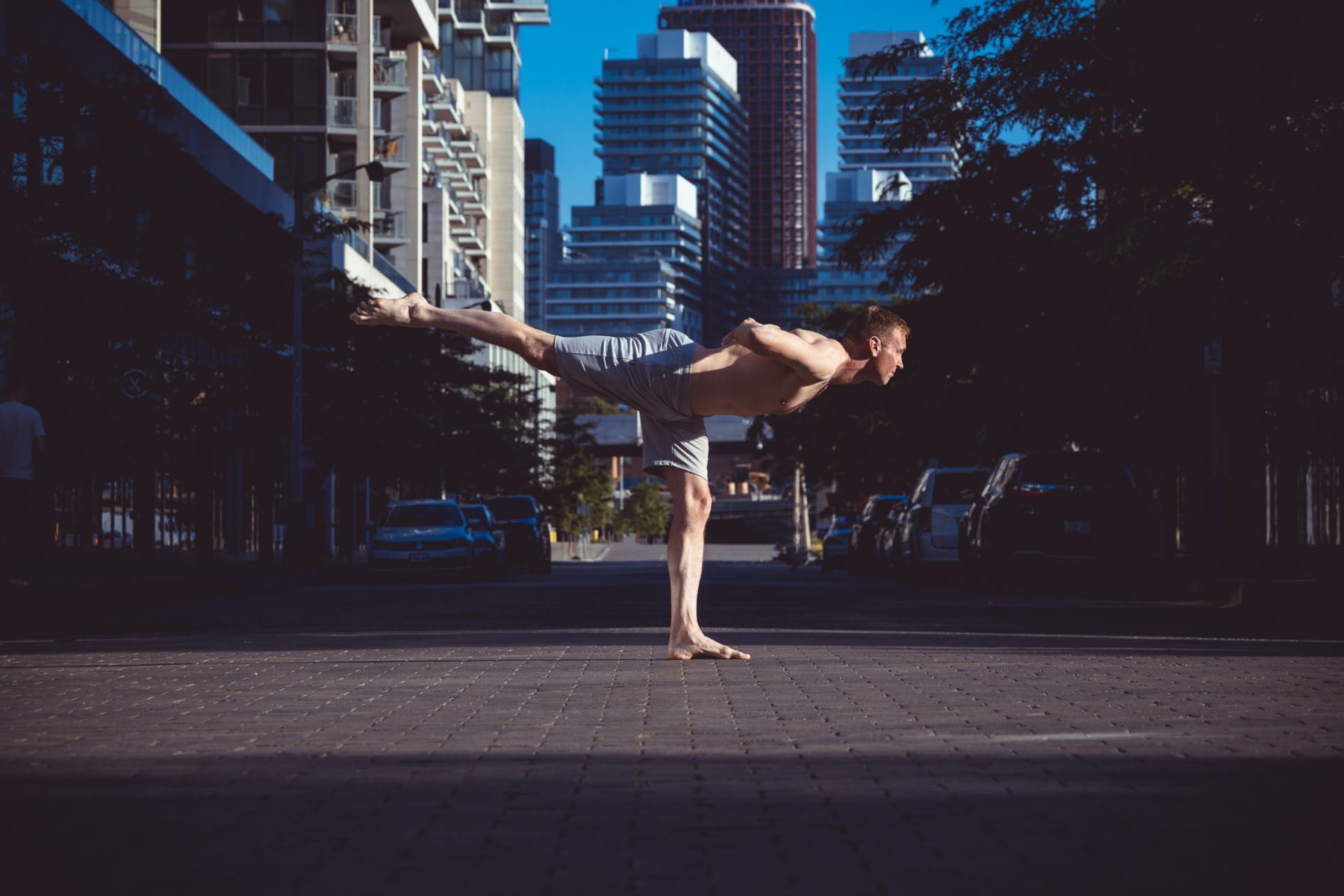 Christopher Gillett in warrior three against the Toronto skyline