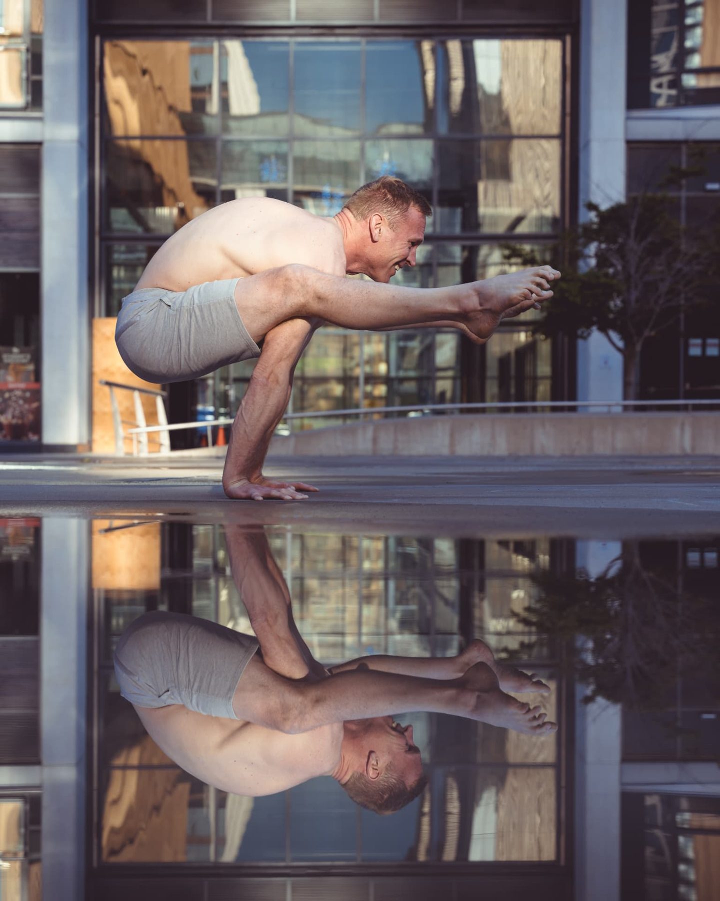 Christopher Gillett in firefly pose reflected in water